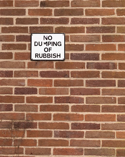 A white commercial van is parked on a street, with three large blue rubbish bags placed on the pavement near the rear end of the vehicle, likely prepared for collection or disposal. The bags are made